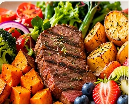 Whole-food meal with steak, vegetables and fruit